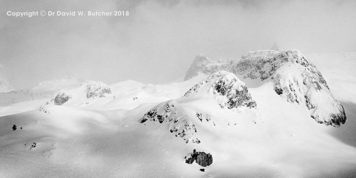 Mountains and mist at the Ischgl ski area in Austria by Dave Butcher