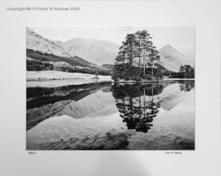 Reflections in Lochan Urr in Glen Etive near Glen Coe, Fort William and Oban in western highlands of Scotland. Munro Buachaille Etive Beag in background.