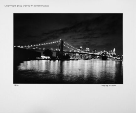 New York Brooklyn Bridge, with Manhattan behind, from Brooklyn at Night, USA