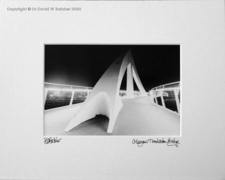 Glasgow Tradeston Bridge over the River Clyde, known as Squiggly Bridge, at night, Scotland