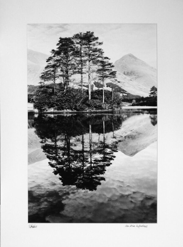 Reflections in Lochan Urr in Glen Etive near Glen Coe, Fort William and Oban in western highlands of Scotland. Munro Buachaille Etive Beag in background