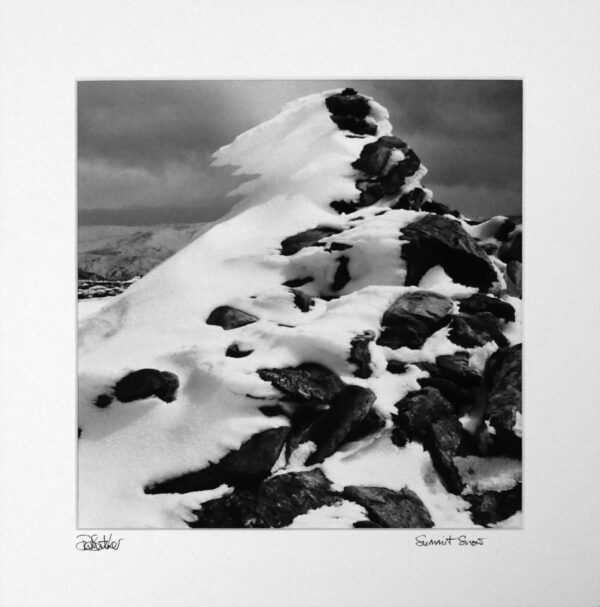 Snow and ice rime on cairn, Ben lawers between Killin and Kenmore in the southern highlands of Scotland
