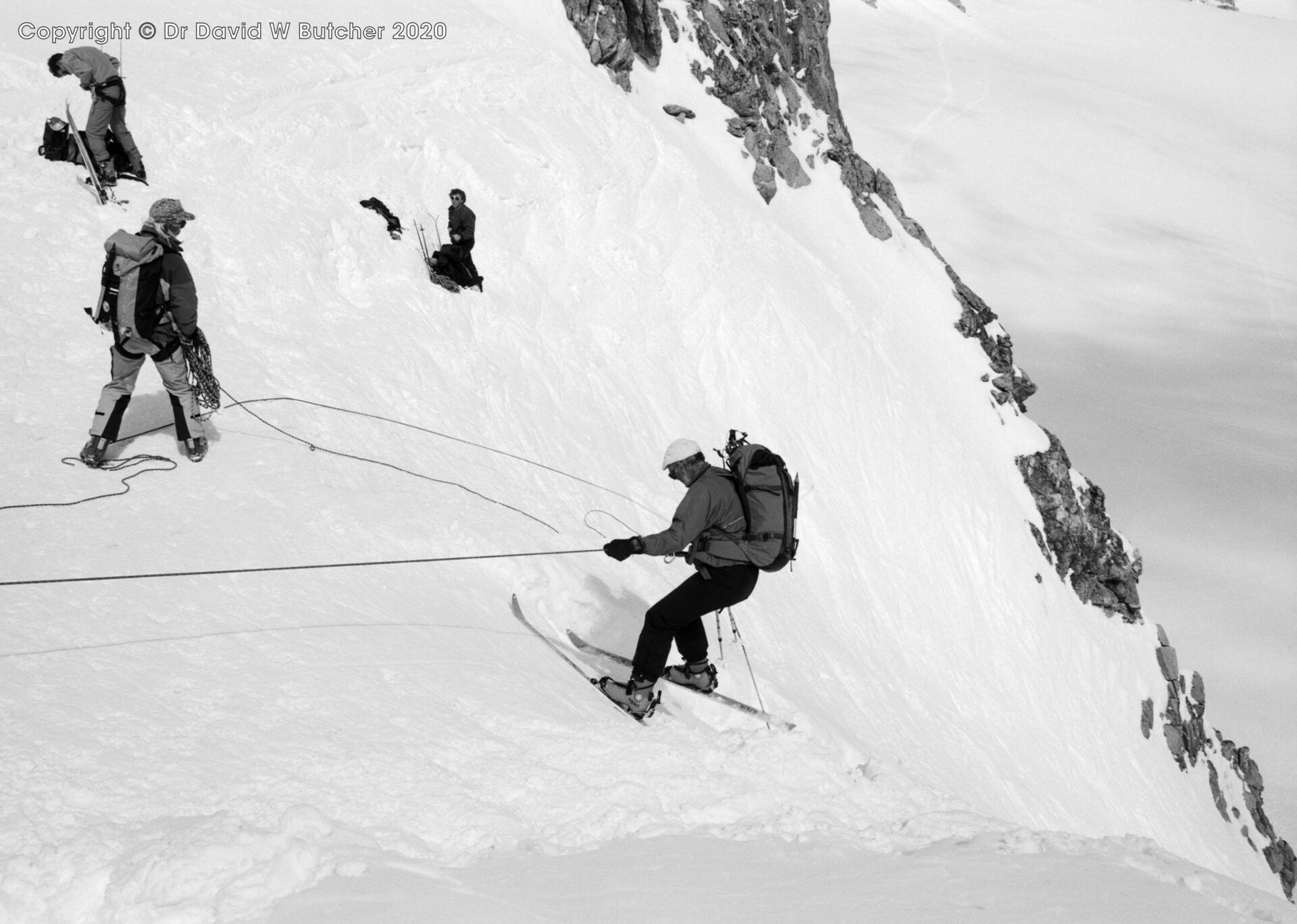 Ski abseil from Col du Chardonnet down steep Swiss side, guide Jon de Montjoye on right, ski Haute Route Day 1