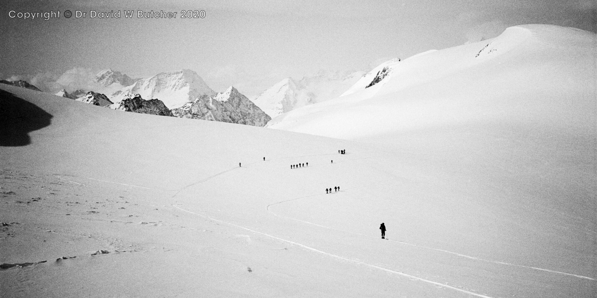 View southwest from Pigne d'Arolla to Pointe d'Otemma at end of ridge on left, snowy dome of La Serpentine on right, ski Haute Route day 5